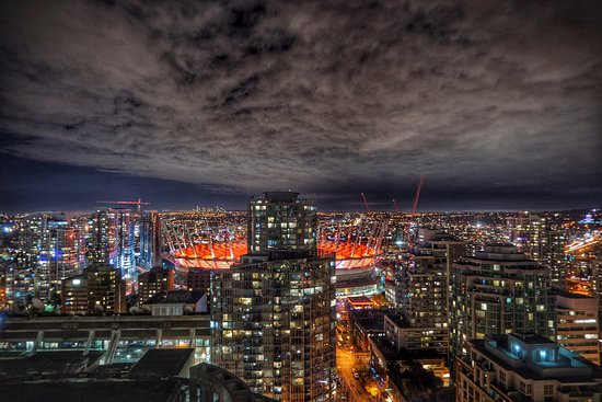 Night city skyline view from a panoramic hotel room